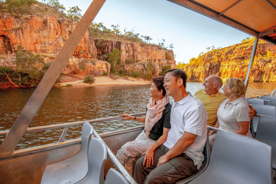 A group of people enjoying a riverboat cruise along Katherine Gorge
