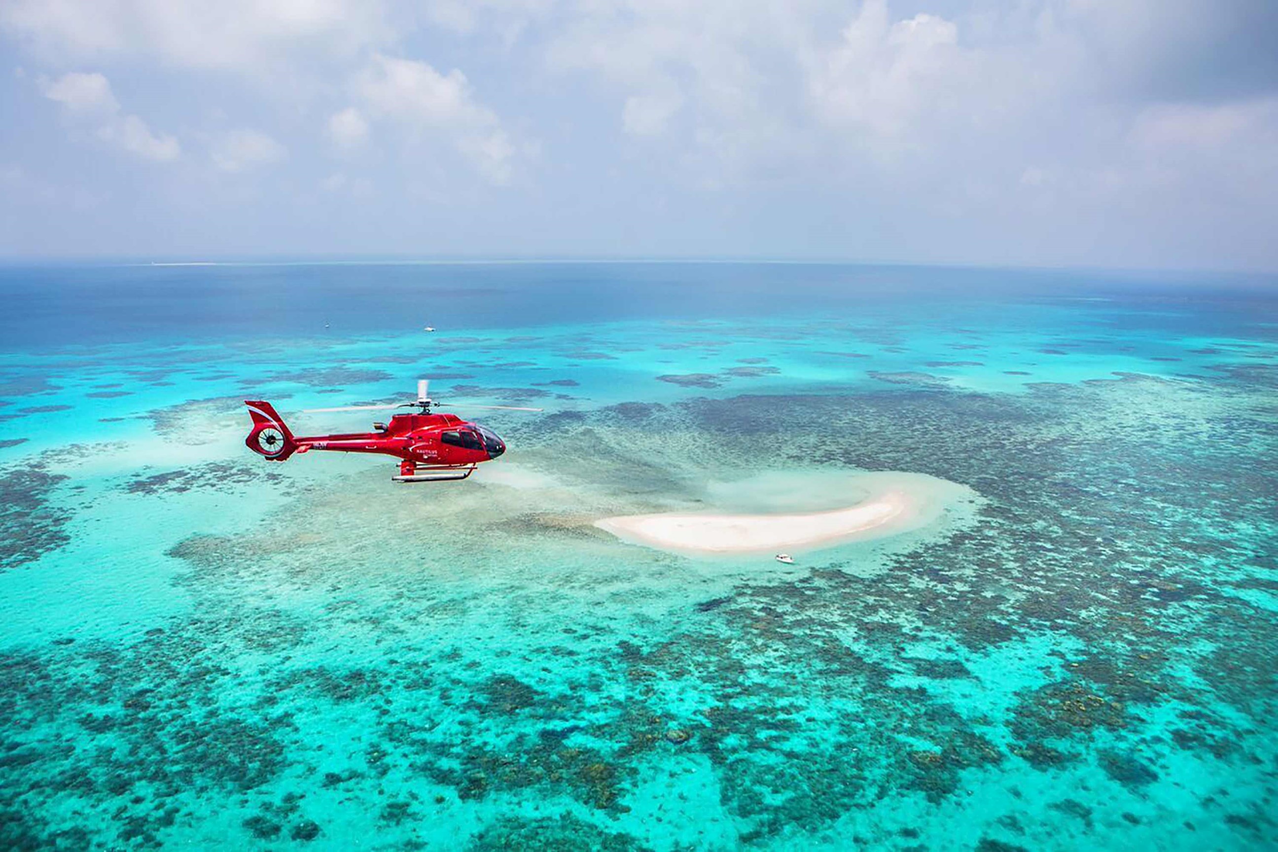 Take a 10-minute scenic flight to witness the iconic Great Barrier Reef from above in Australia