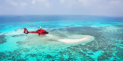 Take a 10-minute scenic flight to witness the iconic Great Barrier Reef from above in Australia