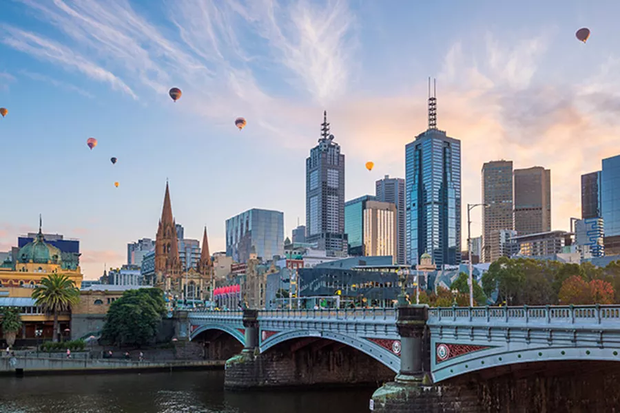 View on Melbourne with hot air balloons in the sky