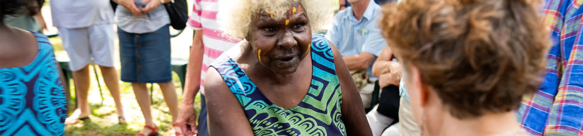 Tourists meet an indigenous woman on Tiwi Islands