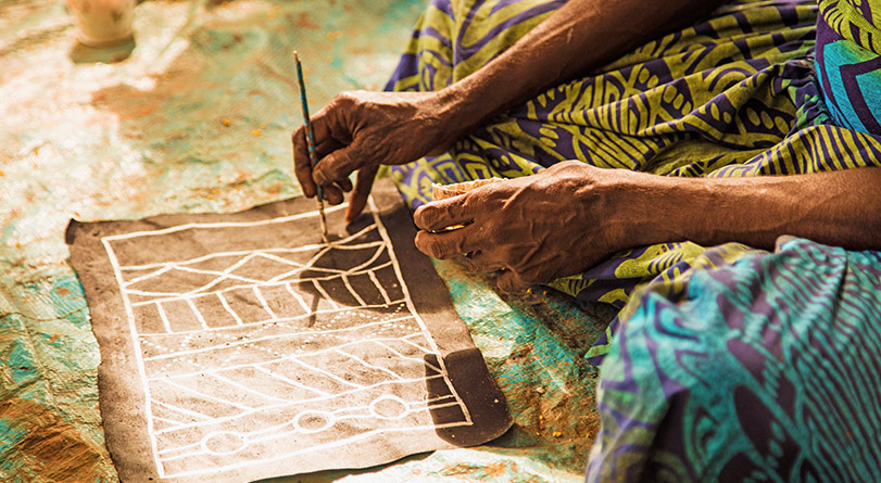 Local making a painting on Tiwi island