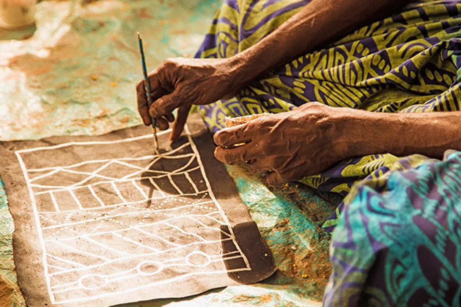 Local making a painting on Tiwi island