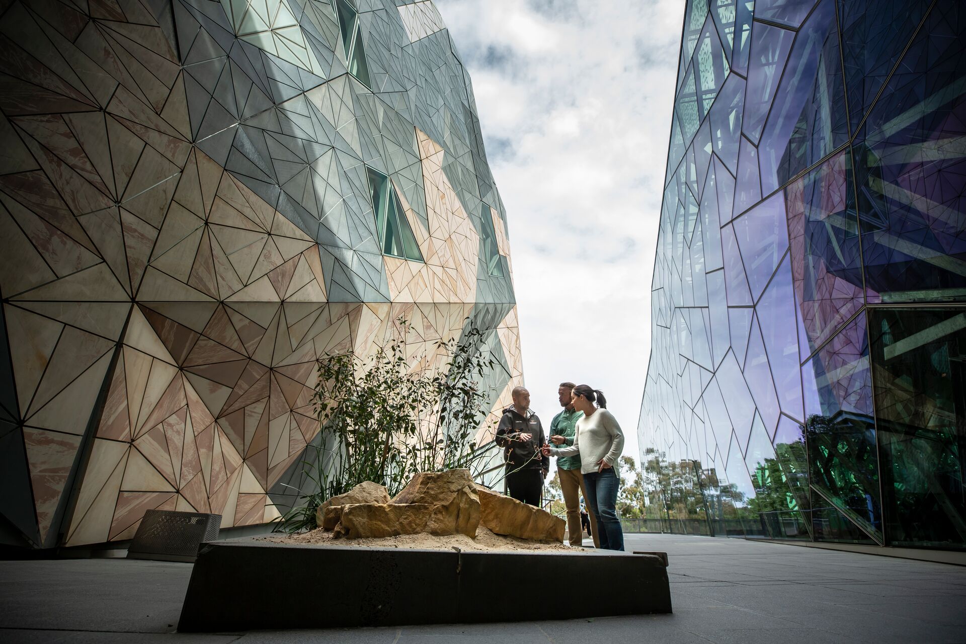 A group of people standing in front of a building