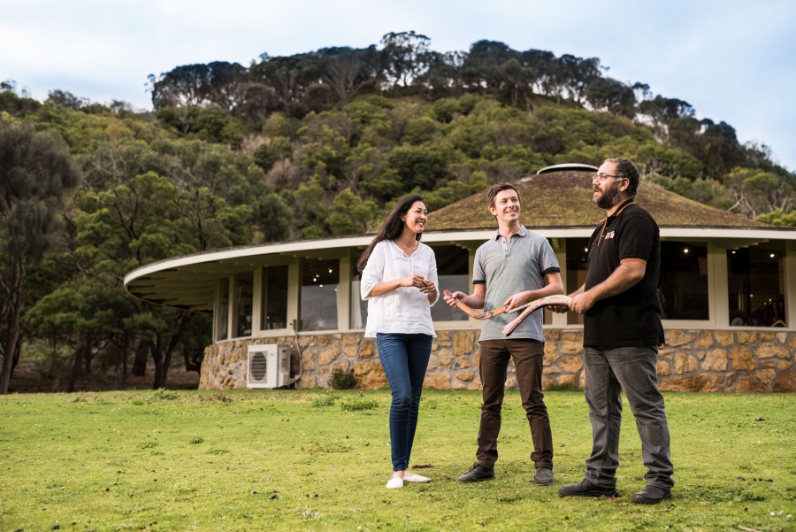 Tourists learning to throw boomerang in Tower Hill Wildlife Reserve