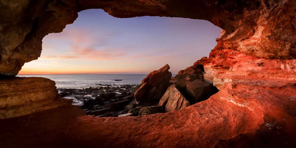 A view of the ocean from inside a cave