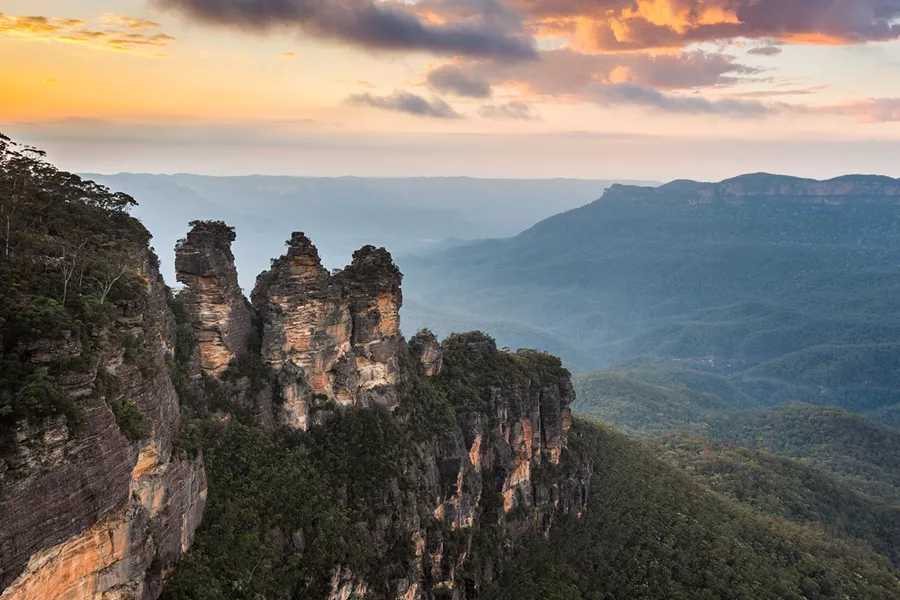The Three Sisters rock formation by sunset