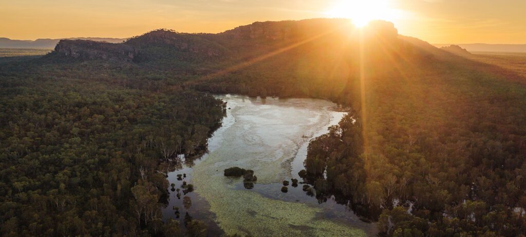 A sunrise aerial view over Kakadu’s wetlands and winding waterways