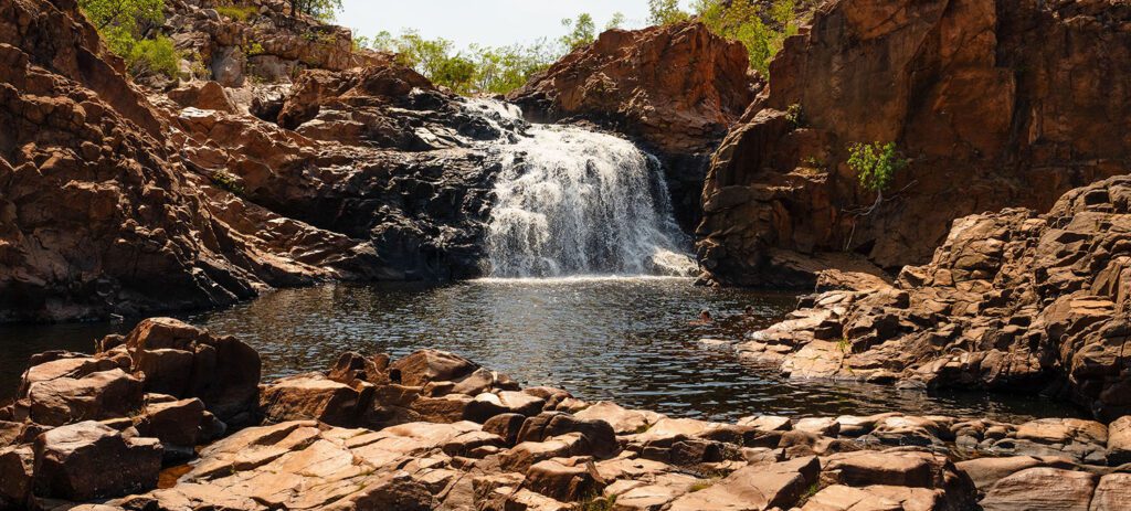Waterfall flowing into a swimming hole at Leliyn (Edith Falls) in Nitmiluk National Park