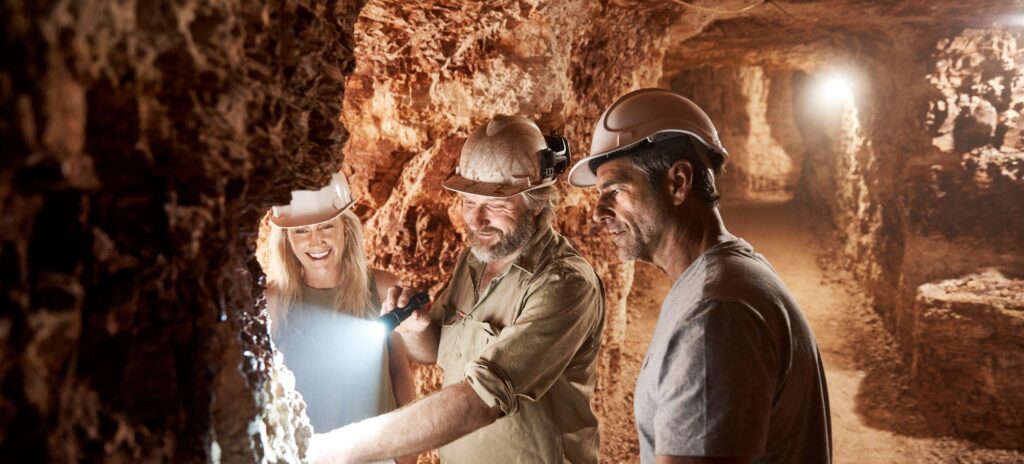 Visitors inside White Cliffs cave